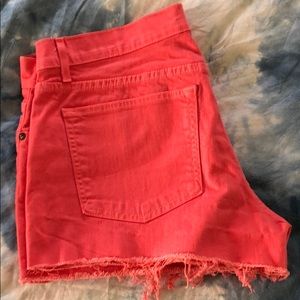 Salmon colored rich and skinny shorts.